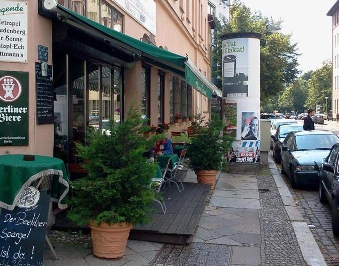 a street with cars parked in front of a store at Apartment Jannowitzbrücke in Berlin