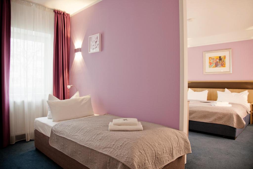 Letto o letti in una camera di Hotel Nikolai Residence