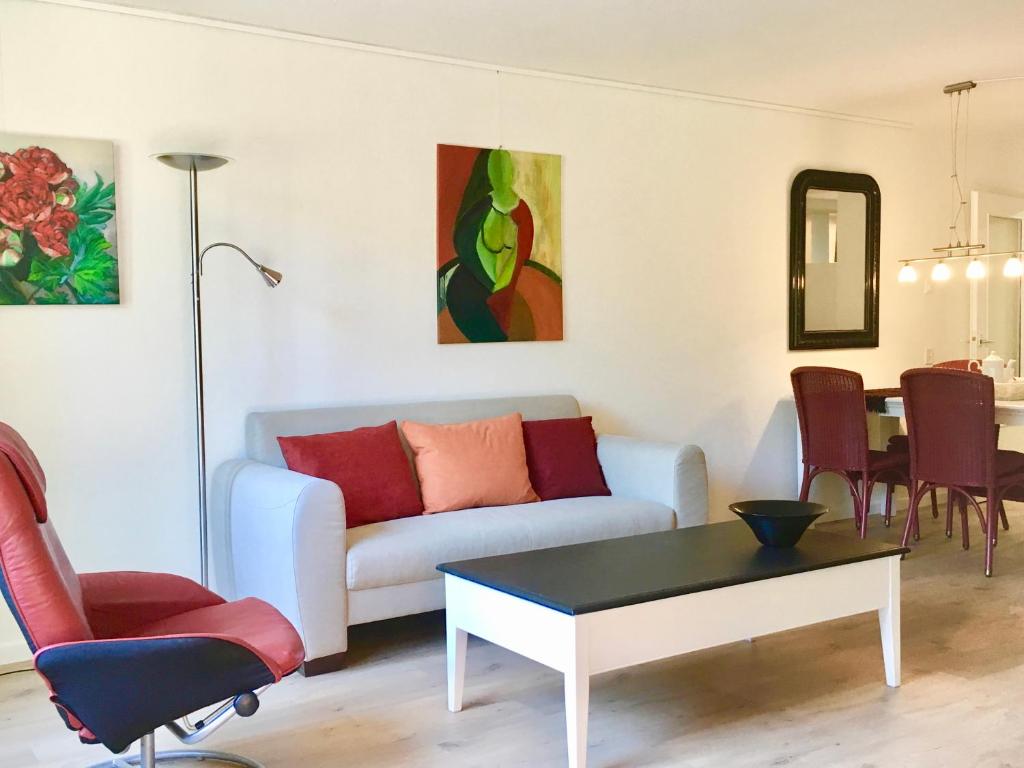 a living room with a couch and a table at Appartement Veerse Kreek in Veere