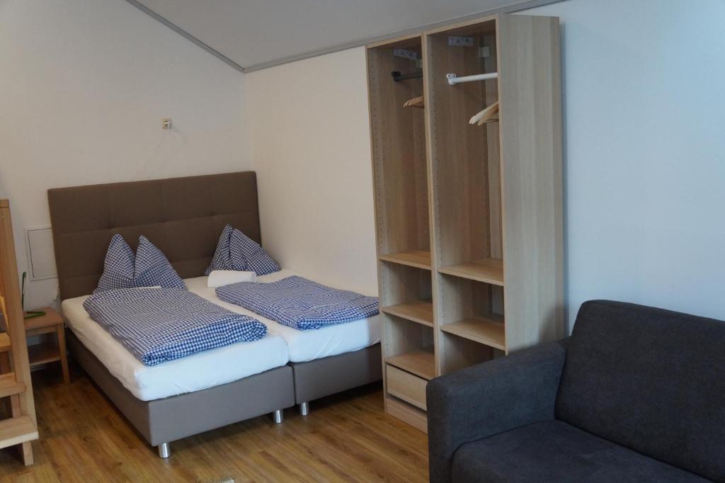 Postel nebo postele na pokoji v ubytování Luise Wehrenfennig & Haus EvA