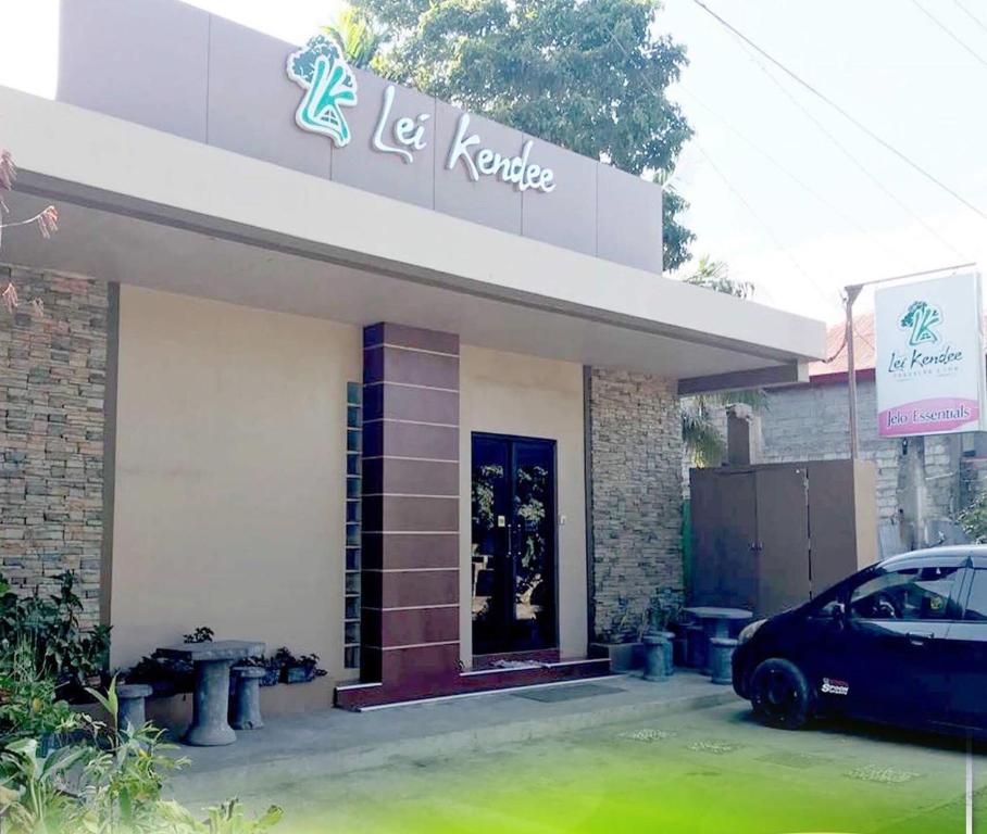 a building with a car parked in front of it at Lei Kendee in Digos