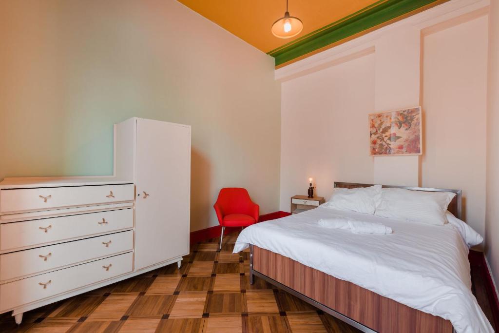 Postel nebo postele na pokoji v ubytování Hostal R10