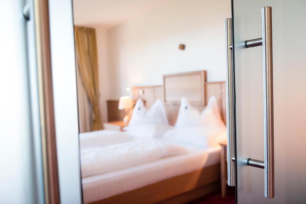 Postel nebo postele na pokoji v ubytování Hotel Peter