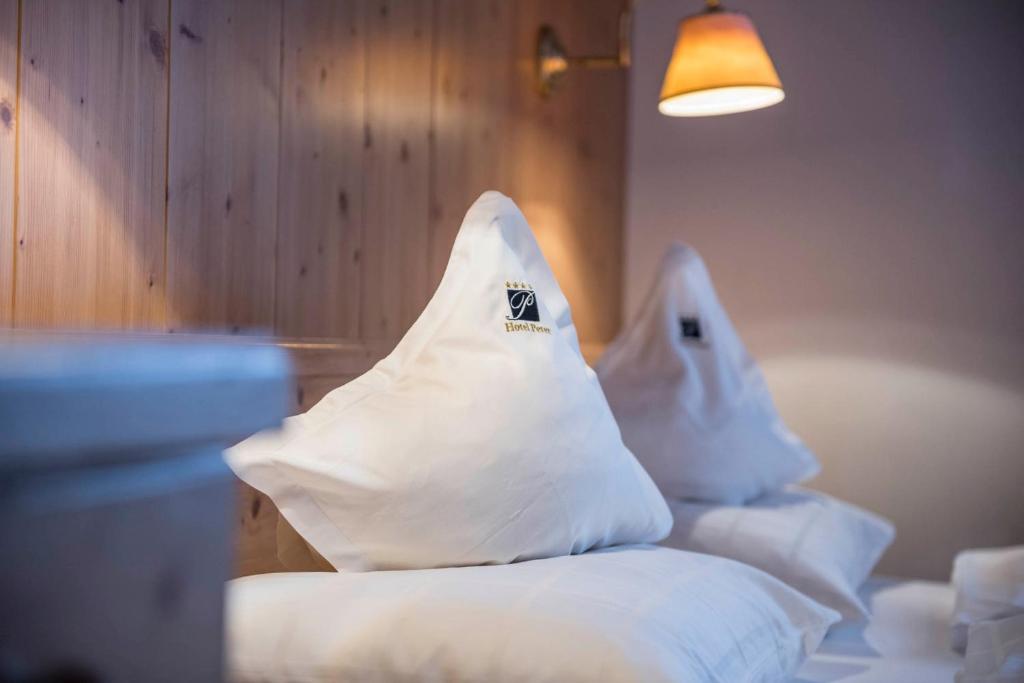 Postel nebo postele na pokoji v ubytování Hotel Peter