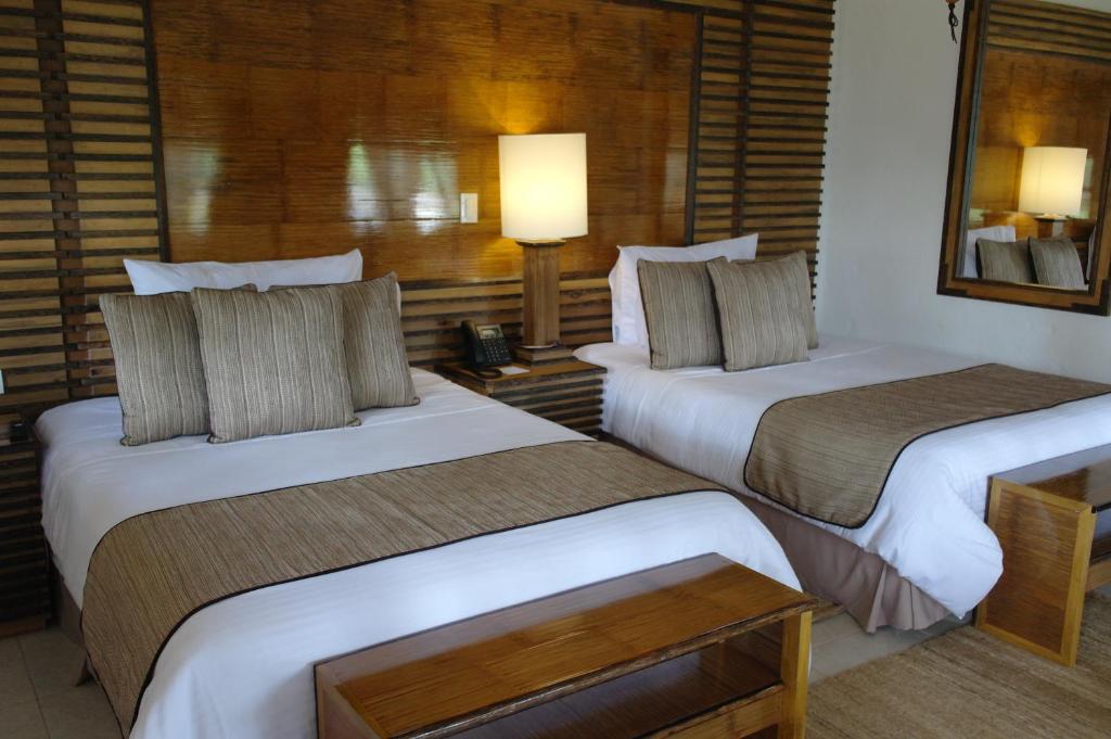 Postel nebo postele na pokoji v ubytování Hotel Casa San Carlos Lodge Pereira