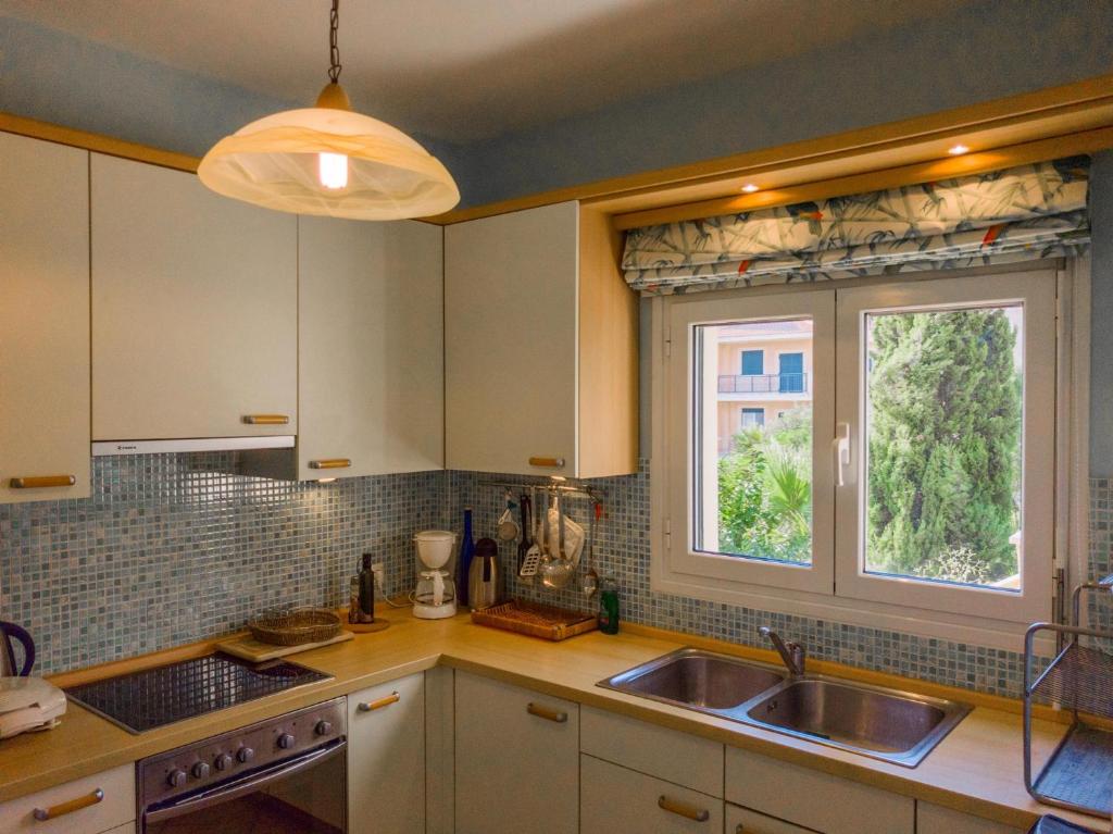 A kitchen or kitchenette at Kounopetra Beach Luxury Villas