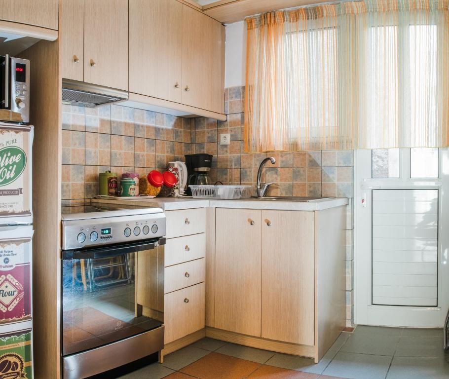 Kuchyňa alebo kuchynka v ubytovaní Fix Divine Apartment