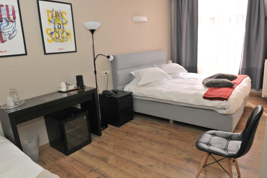 Een bed of bedden in een kamer bij Hotel Palace
