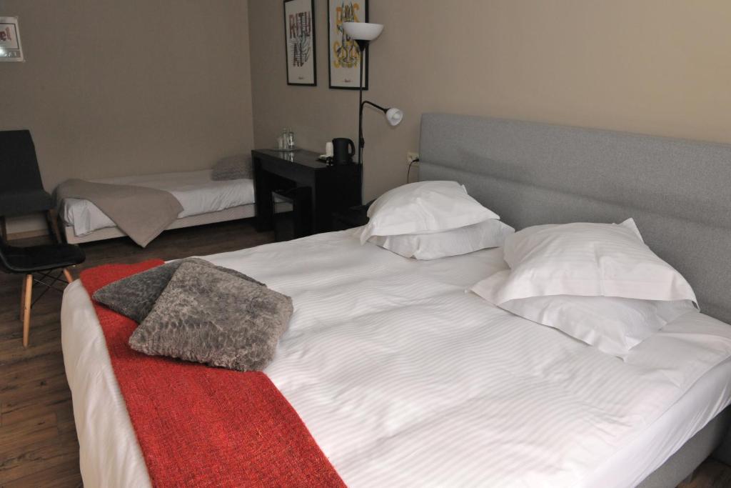 Postel nebo postele na pokoji v ubytování Hotel Palace