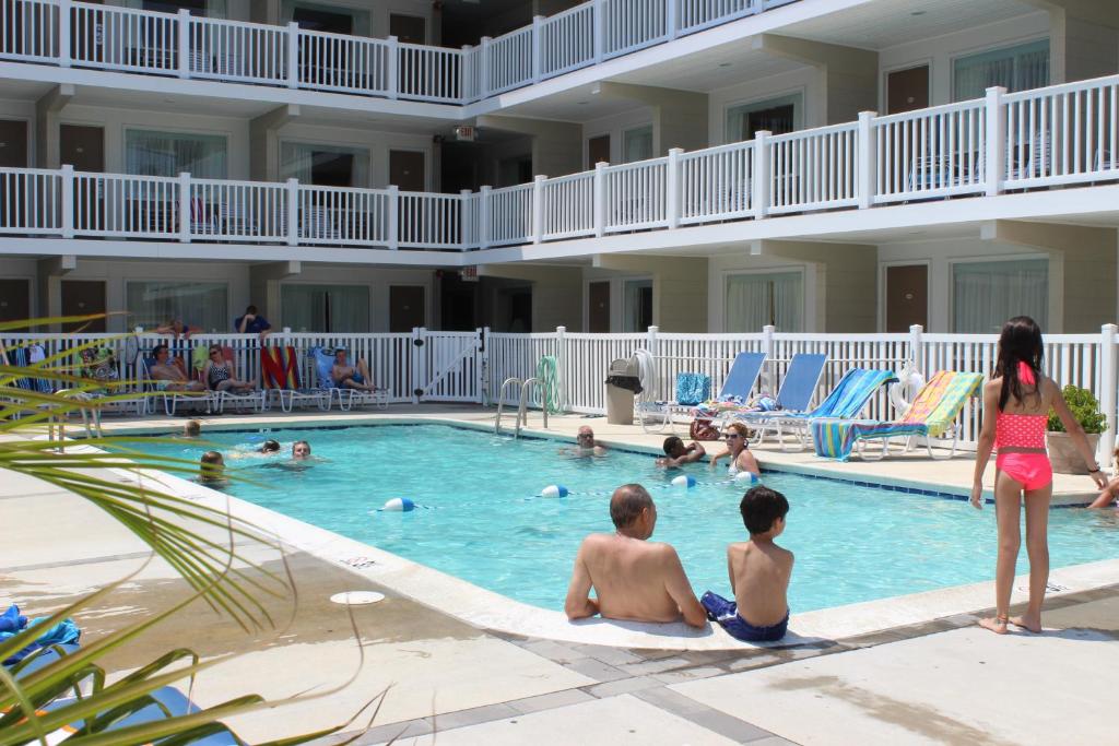 a group of people in the swimming pool at a hotel at Oceanus Motel - Rehoboth Beach in Rehoboth Beach