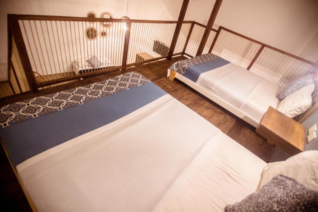 Postel nebo postele na pokoji v ubytování Soy Local Centro Histórico