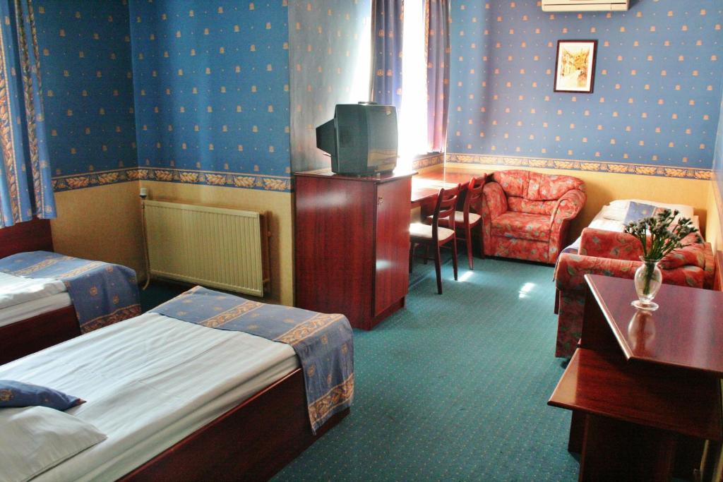 Voodi või voodid majutusasutuse Classic Hotel toas