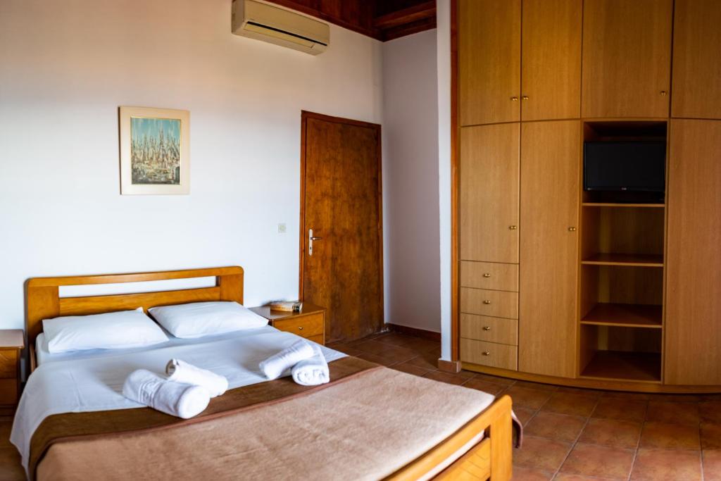 Postel nebo postele na pokoji v ubytování Papanestoras Apartments