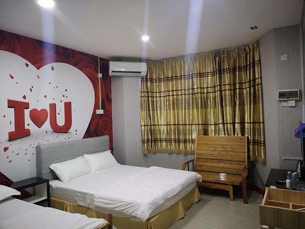 Postel nebo postele na pokoji v ubytování Home Inn Hotel