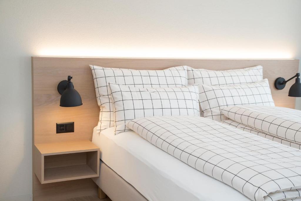 Postel nebo postele na pokoji v ubytování Forum - das Business & Lifestylehotel