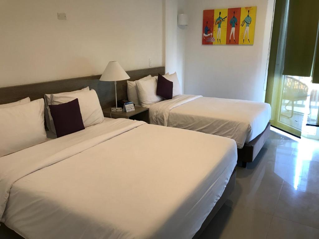 Postel nebo postele na pokoji v ubytování Hotel Decameron Maryland All Inclusive