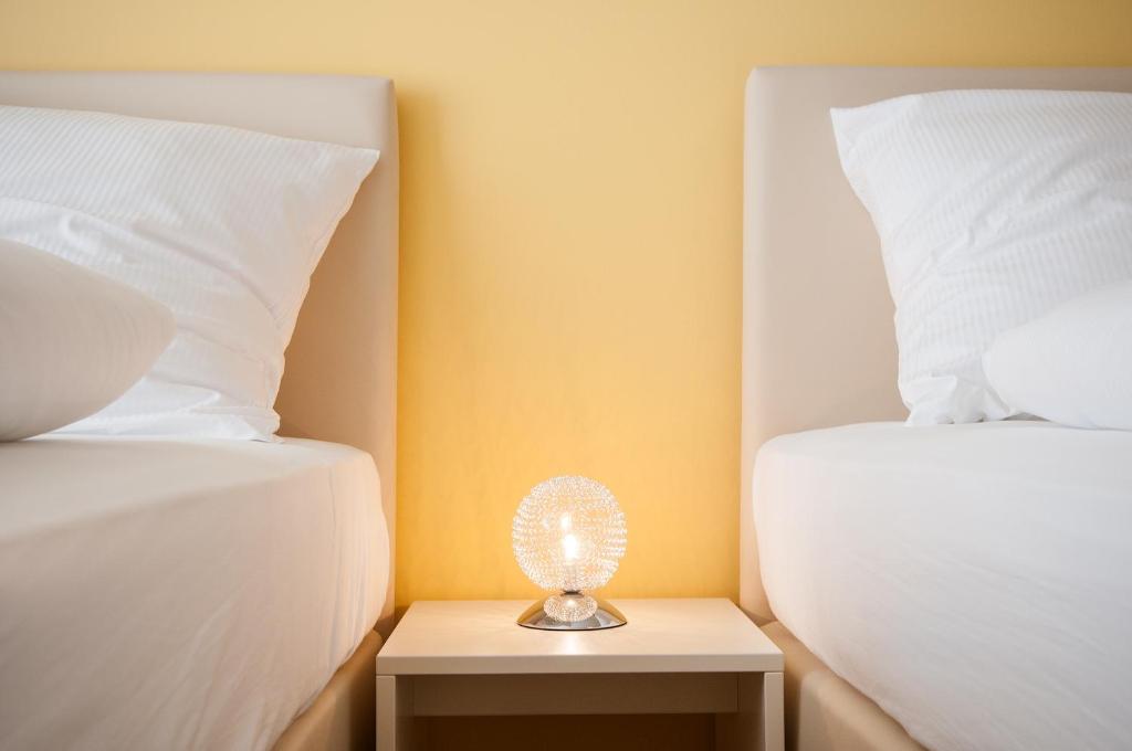 Postel nebo postele na pokoji v ubytování Hotel Elbblick Garni