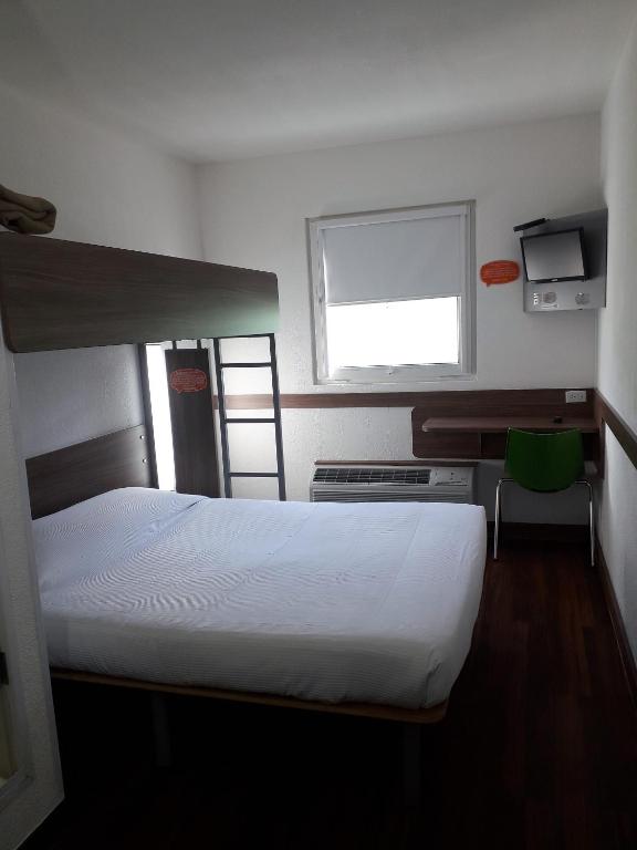 Postel nebo postele na pokoji v ubytování Hotel Hi! Queretaro