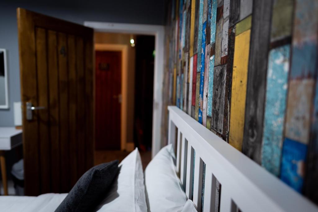 Postel nebo postele na pokoji v ubytování REM Hotel