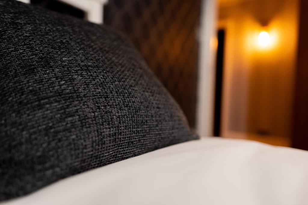 Postel nebo postele na pokoji v ubytování REM Hotel