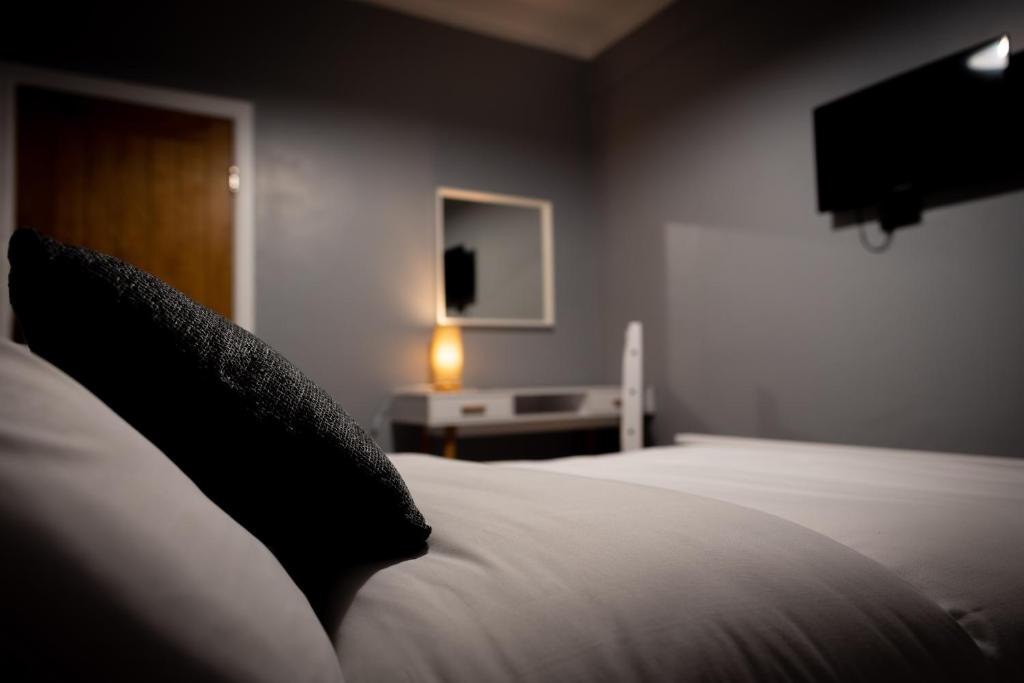 Postel nebo postele na pokoji v ubytování REM Hotel