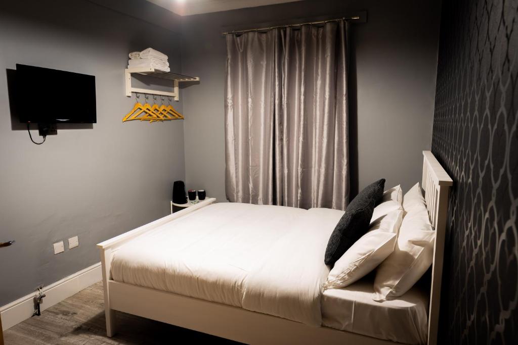 Postel nebo postele na pokoji v ubytování REM Hotel
