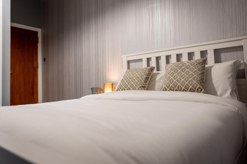 Postel nebo postele na pokoji v ubytování REM Hotel