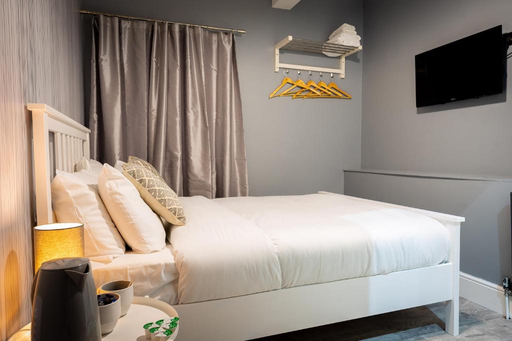 Postel nebo postele na pokoji v ubytování REM Hotel