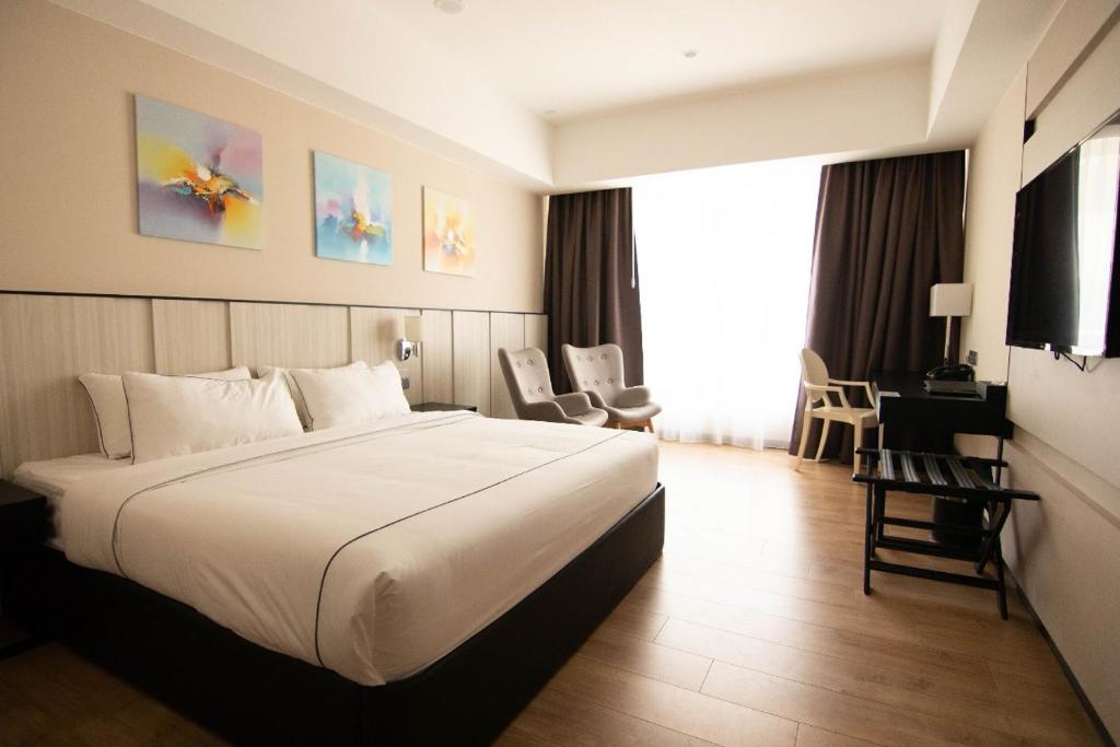 Postel nebo postele na pokoji v ubytování Higher Hotel