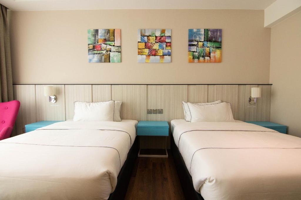 Postel nebo postele na pokoji v ubytování Higher Hotel
