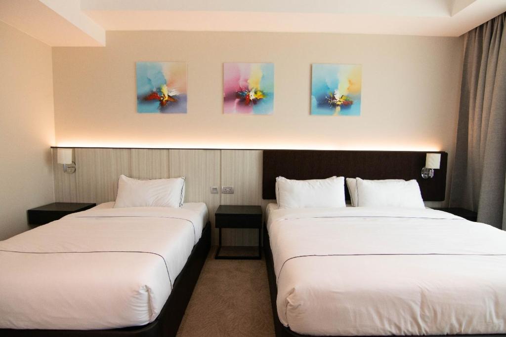Postel nebo postele na pokoji v ubytování Higher Hotel