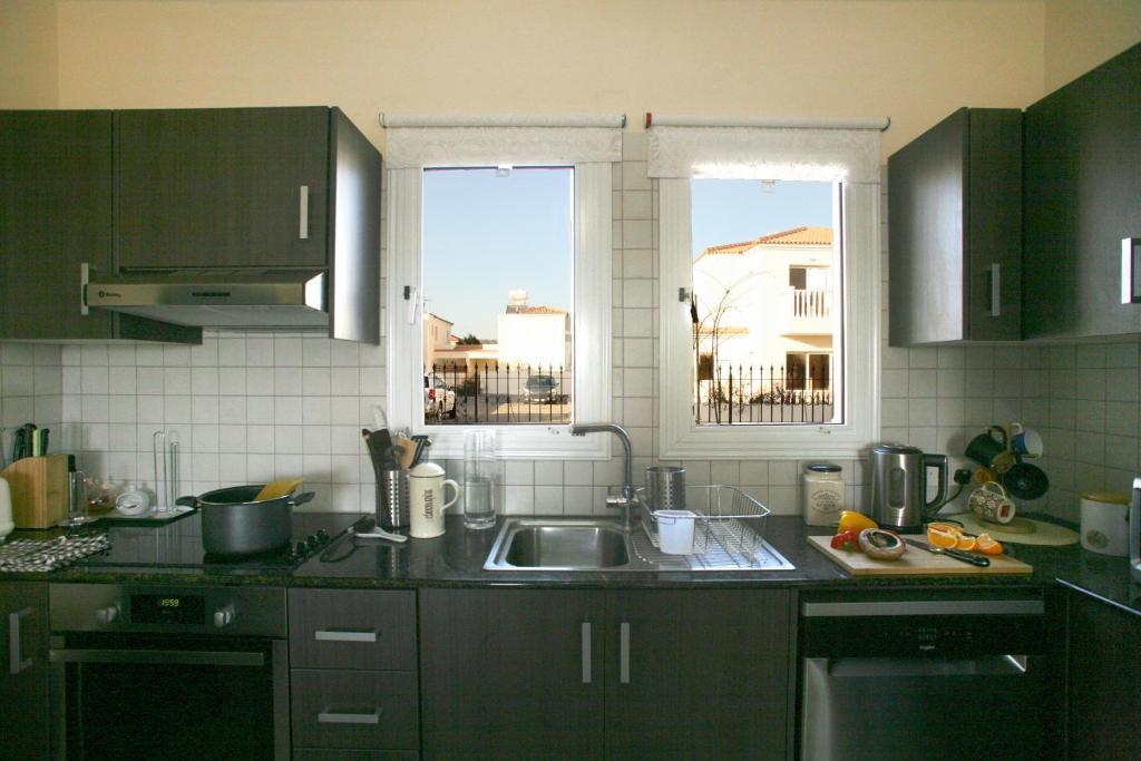 Kuchyň nebo kuchyňský kout v ubytování Villa Carmel
