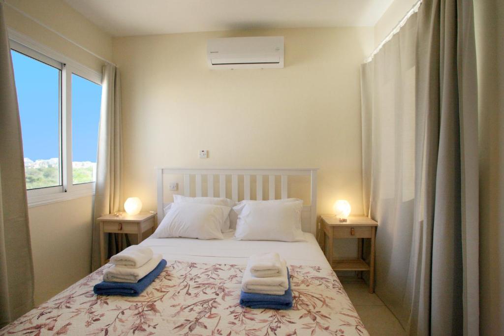 Postel nebo postele na pokoji v ubytování Villa Carmel