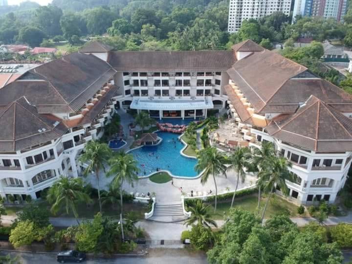 an aerial view of a resort with a swimming pool at The Orient Star Resort Lumut in Lumut