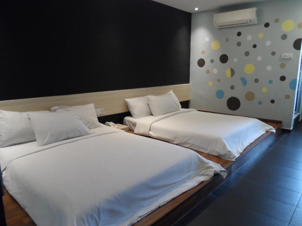 Postel nebo postele na pokoji v ubytování JS Hotel