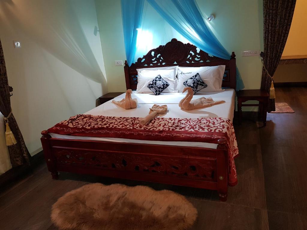 Postel nebo postele na pokoji v ubytování Kerala cottage