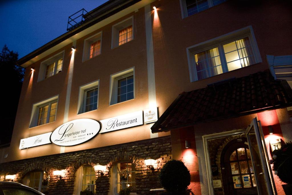 a store front of a building at night at Langerfelder Hof in Wuppertal