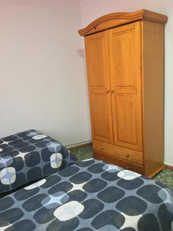 Postel nebo postele na pokoji v ubytování Hostal Gutierrez