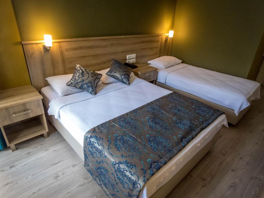 Postel nebo postele na pokoji v ubytování Remer Hotel