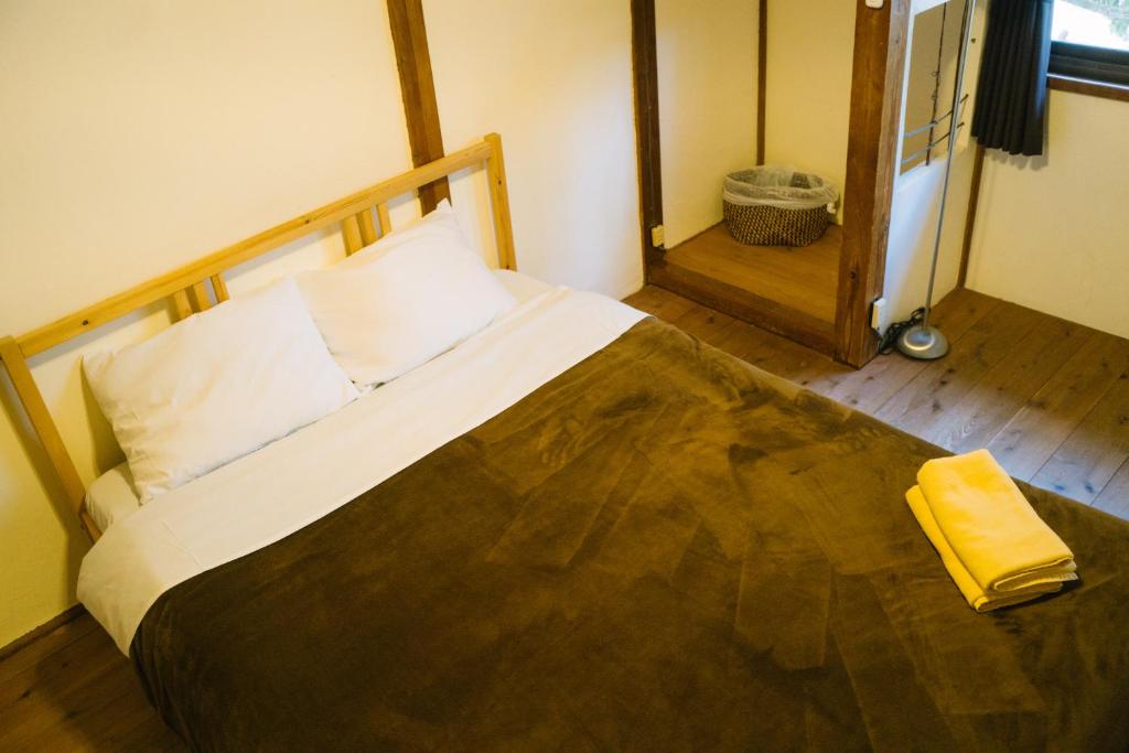 Postel nebo postele na pokoji v ubytování Onsen Guesthouse HAKONE TENT