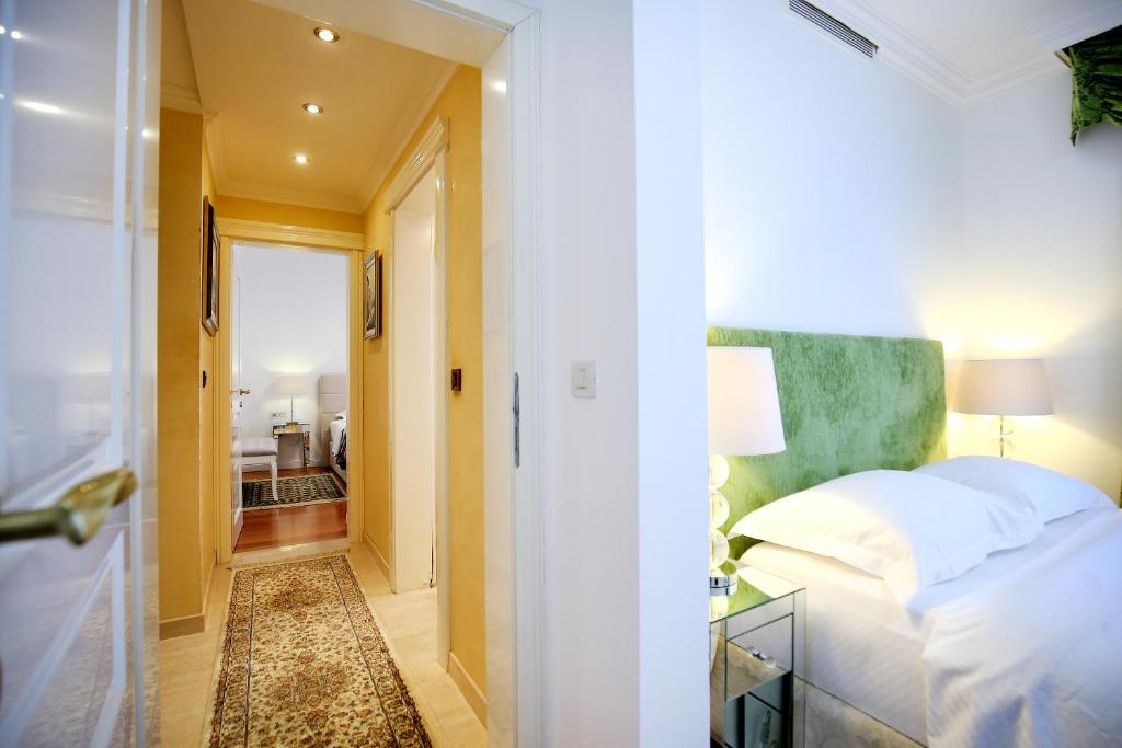Postel nebo postele na pokoji v ubytování Hotel Niko