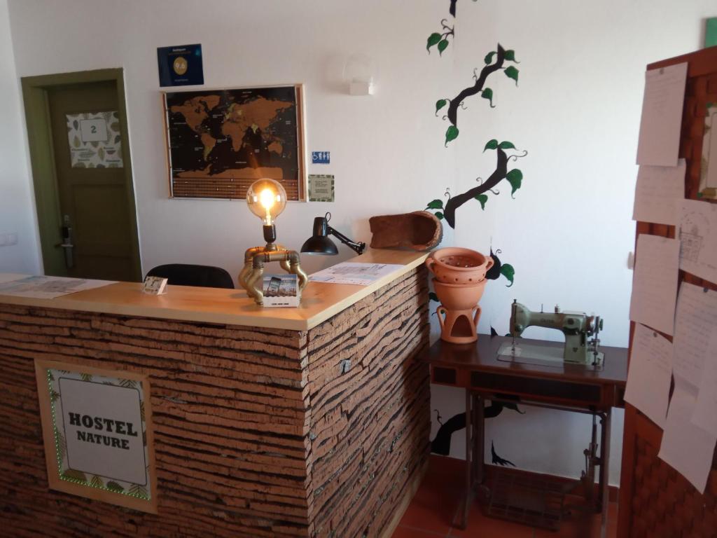 a brick counter with a light on top of it at Hostel Nature in Zambujeira do Mar