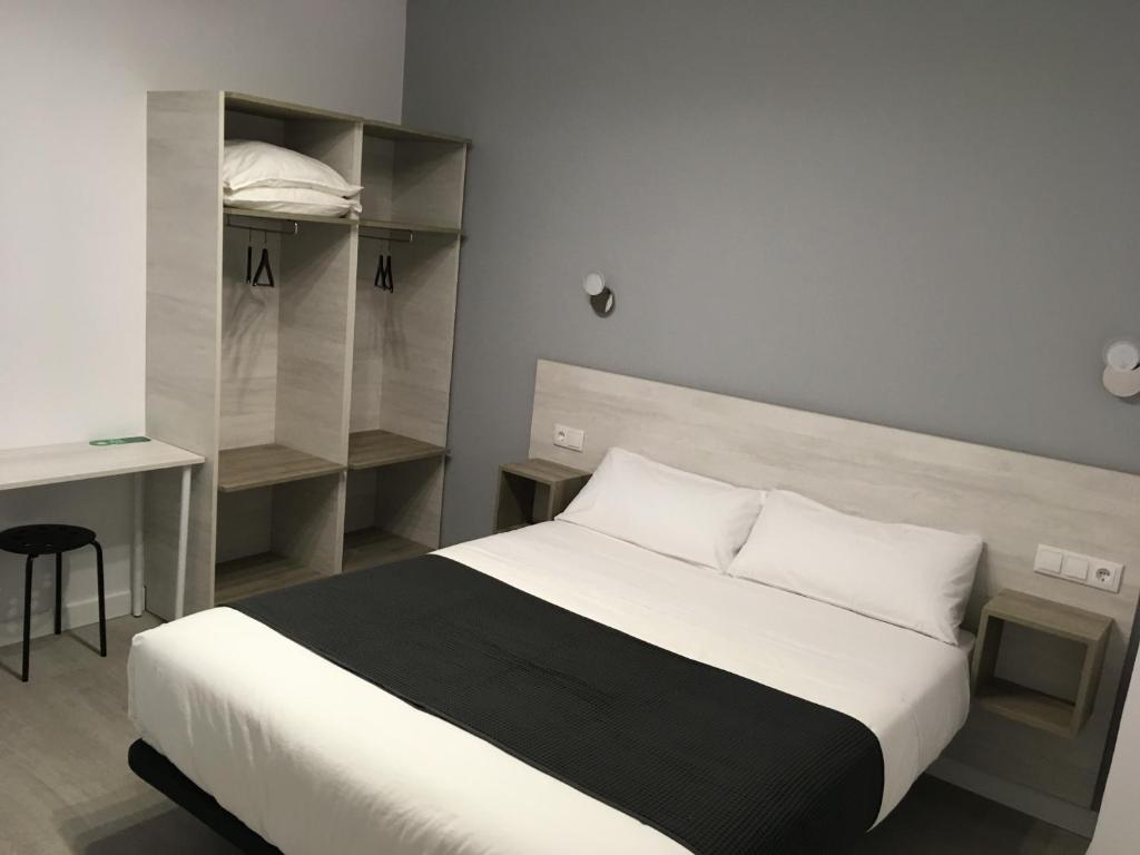 Postel nebo postele na pokoji v ubytování Hostal I Dream Salamanca