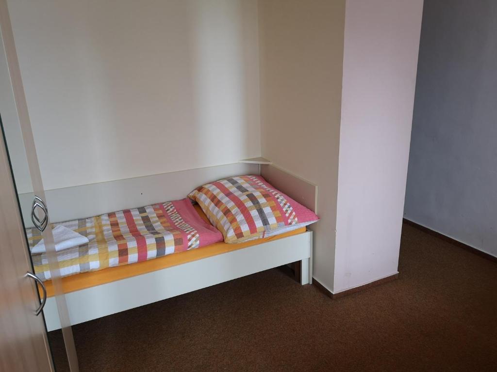 Postel nebo postele na pokoji v ubytování Riegrova Chata Kozákov