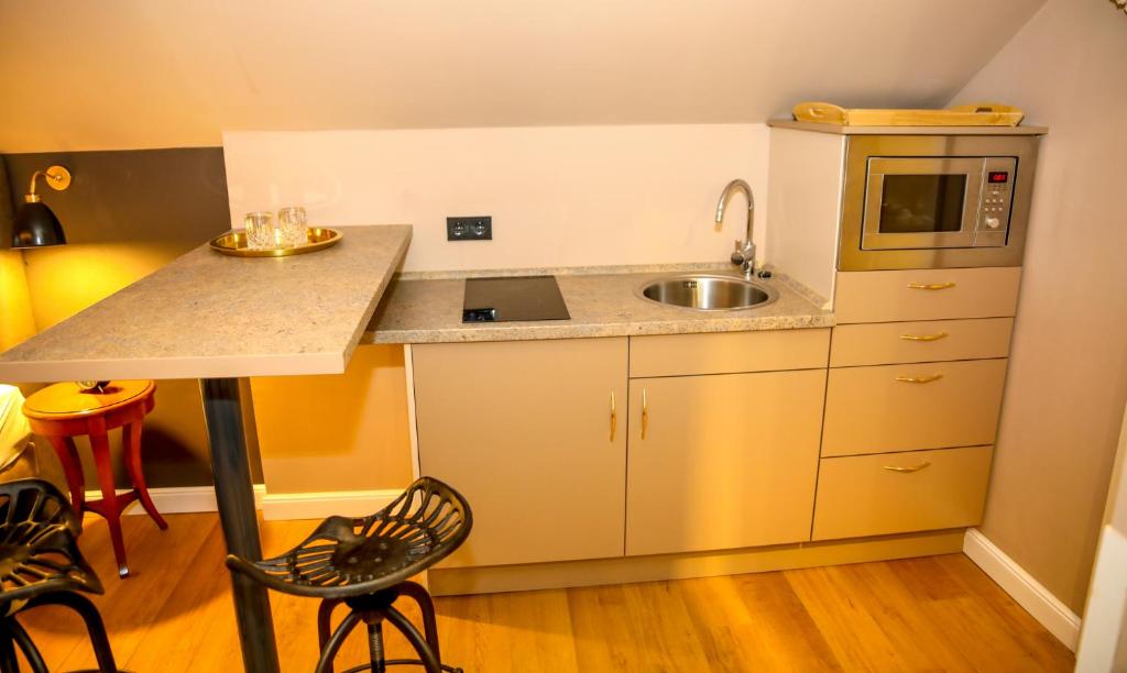 Kuchyň nebo kuchyňský kout v ubytování Nordseehotel Kröger