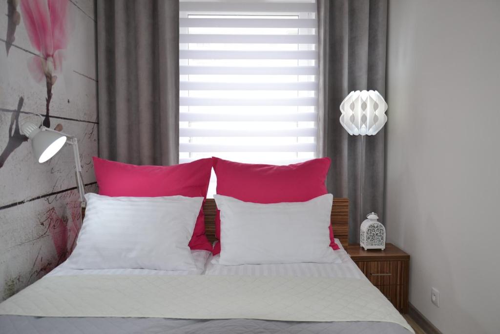 Posteľ alebo postele v izbe v ubytovaní Apartament Sweet House