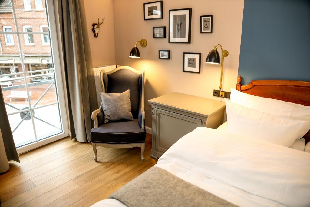 Postel nebo postele na pokoji v ubytování Nordseehotel Kröger