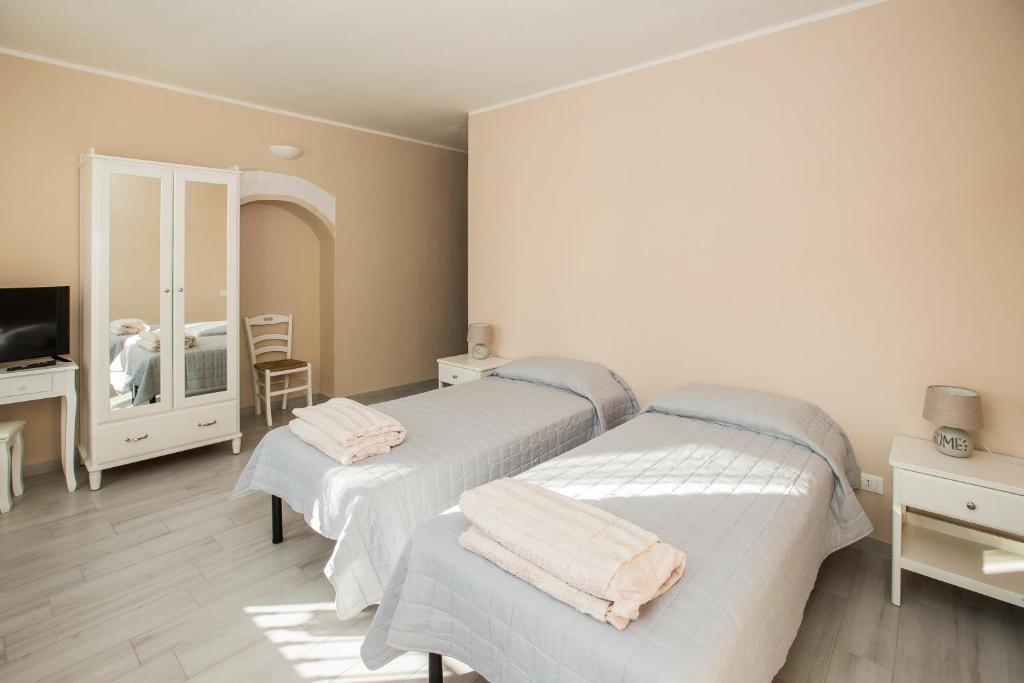 Postel nebo postele na pokoji v ubytování 700enolocanda