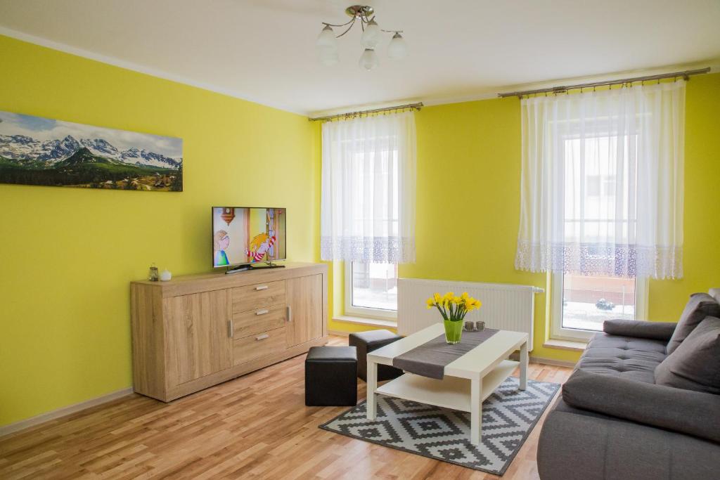 Televízia a/alebo spoločenská miestnosť v ubytovaní Family Homes - Apartamenty Sonoma