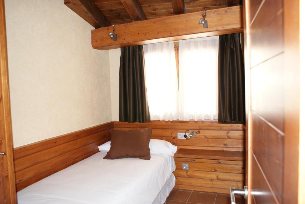 Postel nebo postele na pokoji v ubytování Aparthotel Bellver
